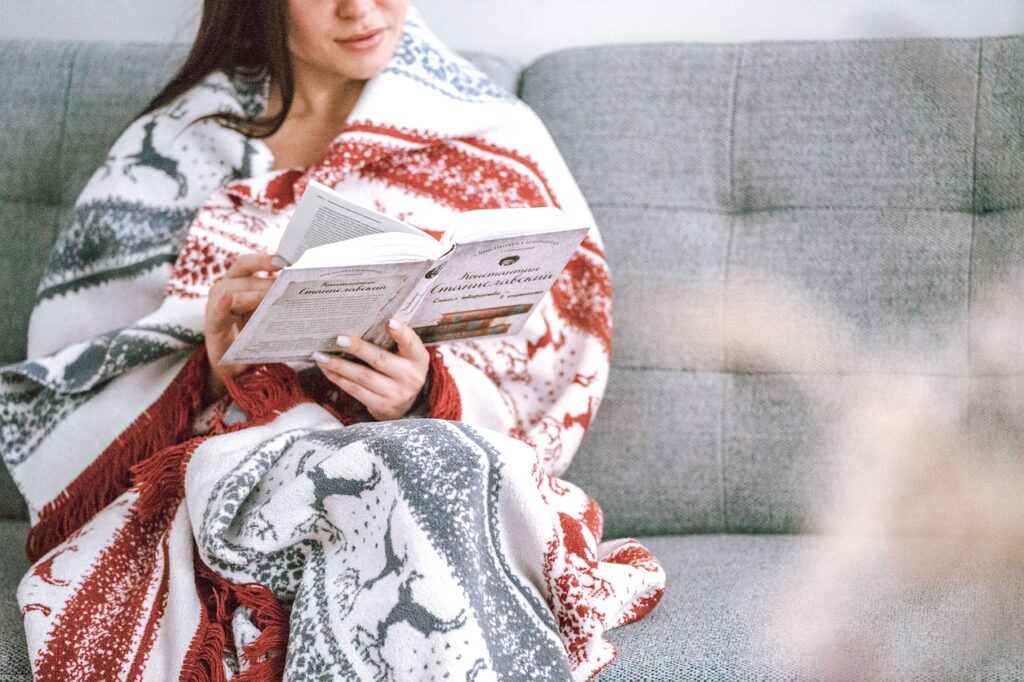 woman enjoys book after skylight repair installers fix window
